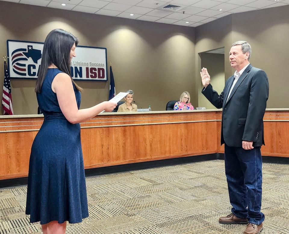 Randall Davis takes his oath of office Monday as an interim appointment to the Canyon Independent School Board.