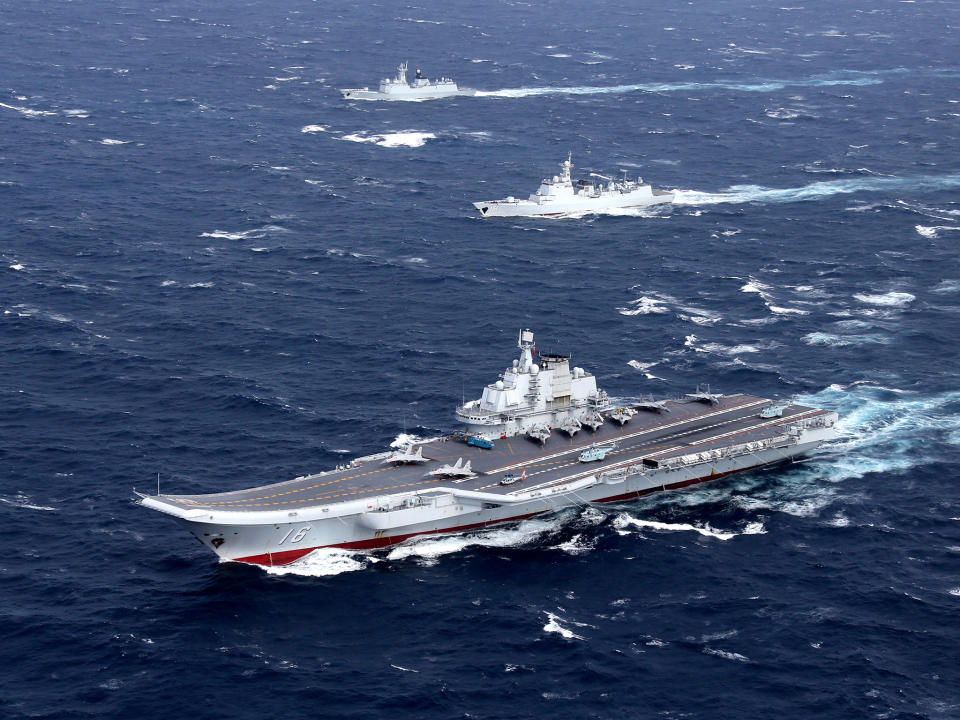 China's Liaoning aircraft carrier with accompanying fleet conducts a drill in the South China Sea: Reuters