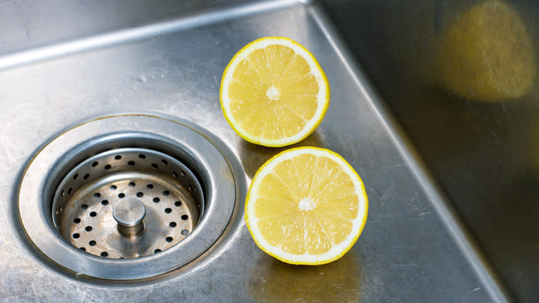 Halved lemon in kitchen sink