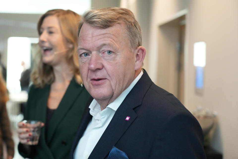 Leader of the Moderates Lars Loekke Rasmussen and leader of Danish Social Liberal Party Sofie Carsten Nielsen, in the background, arrive for the traditional post-election debates in Copenhagen, Denmark, Wednesday, Nov. 2, 2022. Voters in Greenland secured the last two seats necessary for the center-left bloc of Prime Minister Mette Frederiksen to win Denmark's general election. (AP Photo/Sergei Grits)