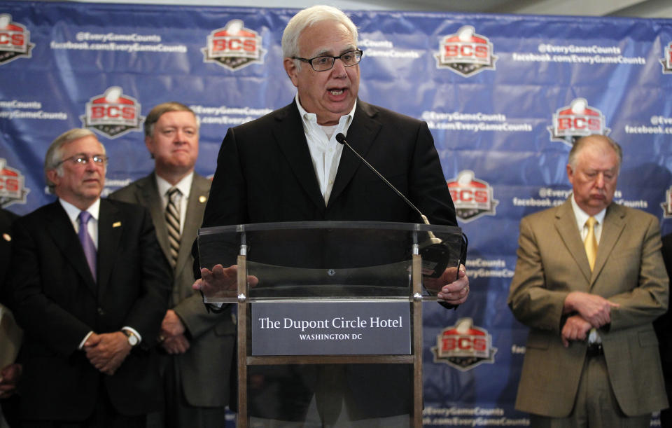 Scott Cowen, Tulane University president, speaks during a media availability after a BCS presidential oversight committee meeting, Tuesday, June 26, 2012, in Washington. The committee announced a new post-season format for a four-team playoff for the major college football national championship. (AP Photo/Alex Brandon)