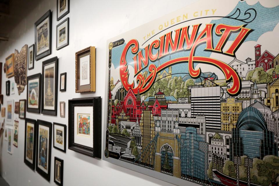 A gallery wall includes frames screen prints, metal prints, laser wood cuts and other example of James Billiter’s work at Billiter Studio in the Walnut Hills neighborhood of Cincinnati on Wednesday, Nov. 3, 2021.