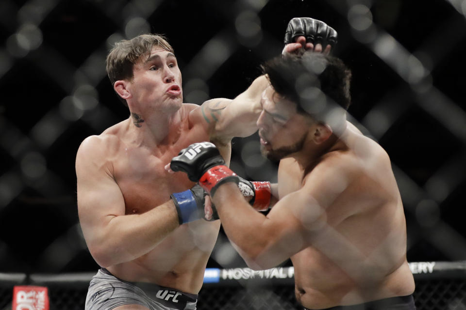 Britain's Darren Till, left, punches Kelvin Gastelum during the second round of a middleweight mixed martial arts bout at UFC 244 on Saturday, Nov. 2, 2019, in New York. Till won the fight. (AP Photo/Frank Franklin II)