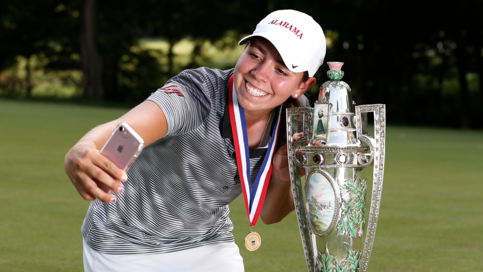 Kristen Gillman celebrates with the Robert Cox Trophy after winning the U.S. Women's Amateur. (Steven Gibbons/USGA)