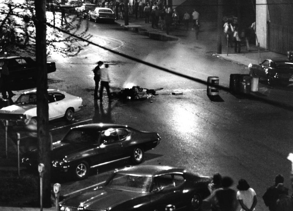 A bonfire burns in the middle of S. Water Street as “rioters” in downtown Kent vandalized businesses as they shouted “Down with Nixon” on Friday, May 1 and into the early hours of May 2, 1970. Police used tear gas to disperse the crowds around 3 a.m.