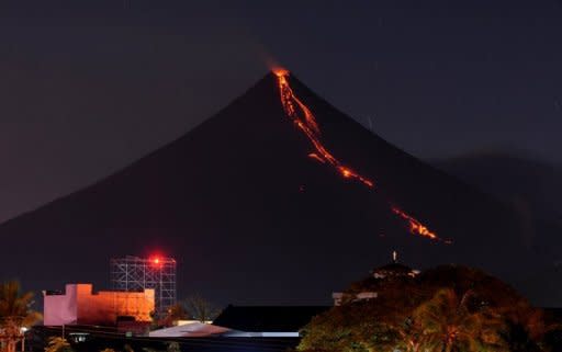 Lava cascades down the slopes of Mayon volcano as seen from Legazpi City, Albay province, 330 km southeast of Manila, in 2009. Asian countries dominate a league table of economies most at risk from earthquakes, floods, storms and other natural hazards, according to research published on Wednesday