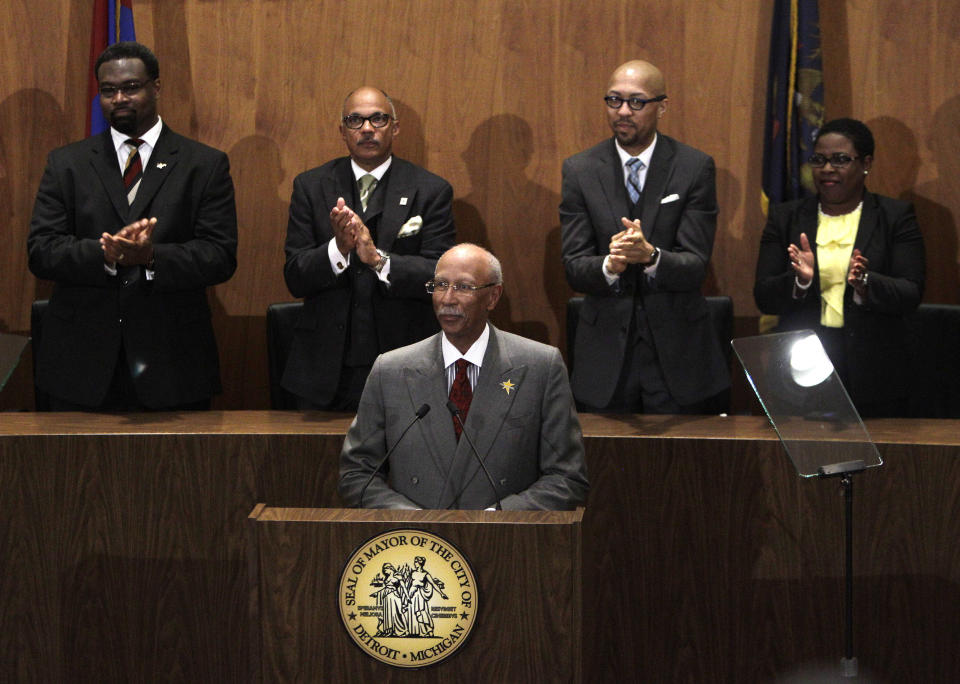 Detroit Mayor Dave Bing, standing in front of the city council, lays out his plans and highlights accomplishments in his third State of the City address in Detroit, Wednesday, March 7, 2012. (AP Photo/Carlos Osorio)