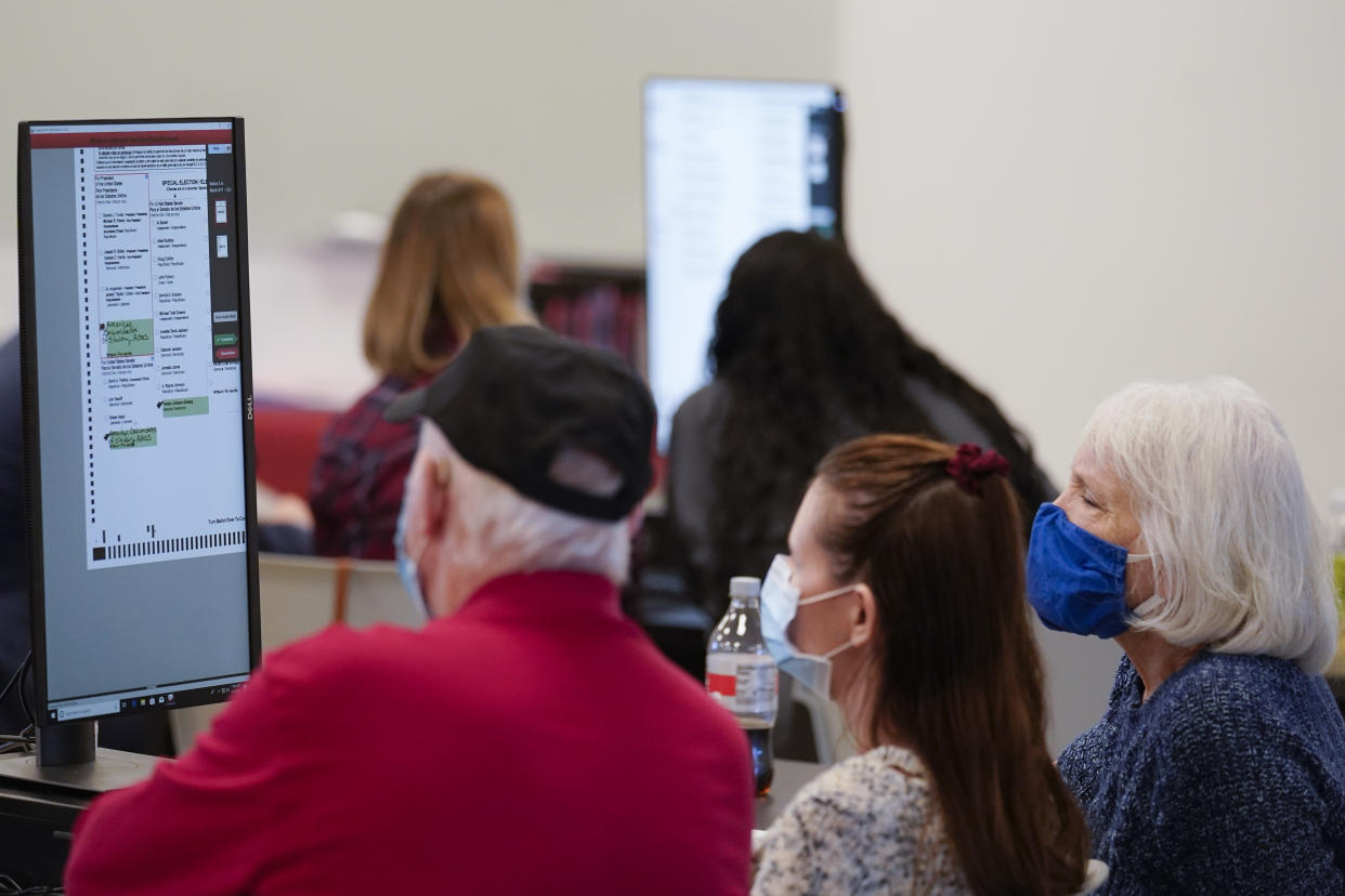 Officials work on ballots at the Gwinnett County Voter Registration and Elections Headquarters on Nov. 6, 2020, in Lawrenceville, near Atlanta. (John Bazemore/AP)