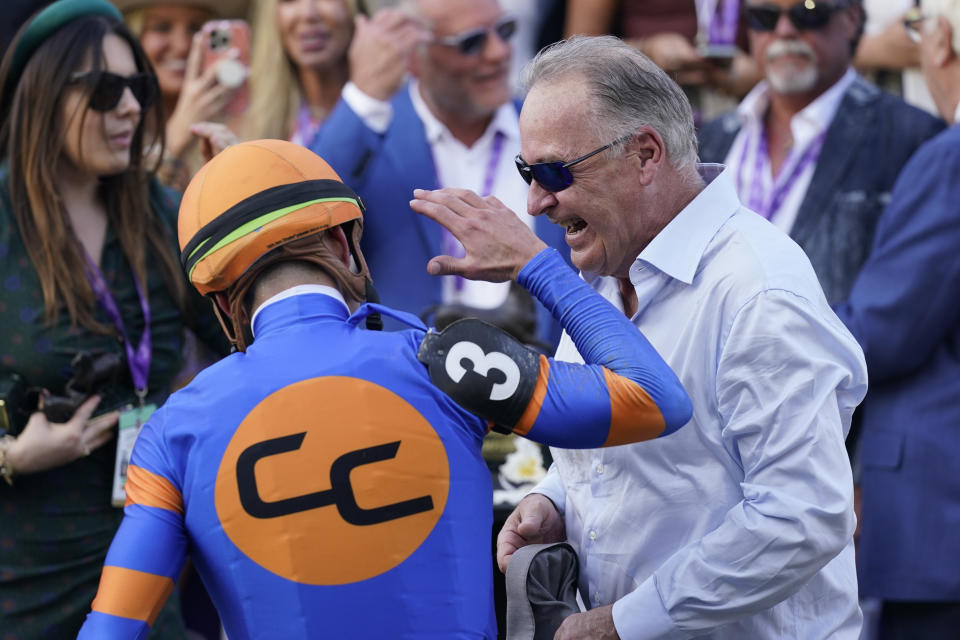 Trainer Rick Dutrow, right, celebrates with jockey Irad Ortiz Jr. after Ortiz Jr. rode White Abarrio to win the Breeders' Cup Classic horse race Saturday, Nov. 4, 2023, at Santa Anita Park in Arcadia, Calif. (AP Photo/Ashley Landis)