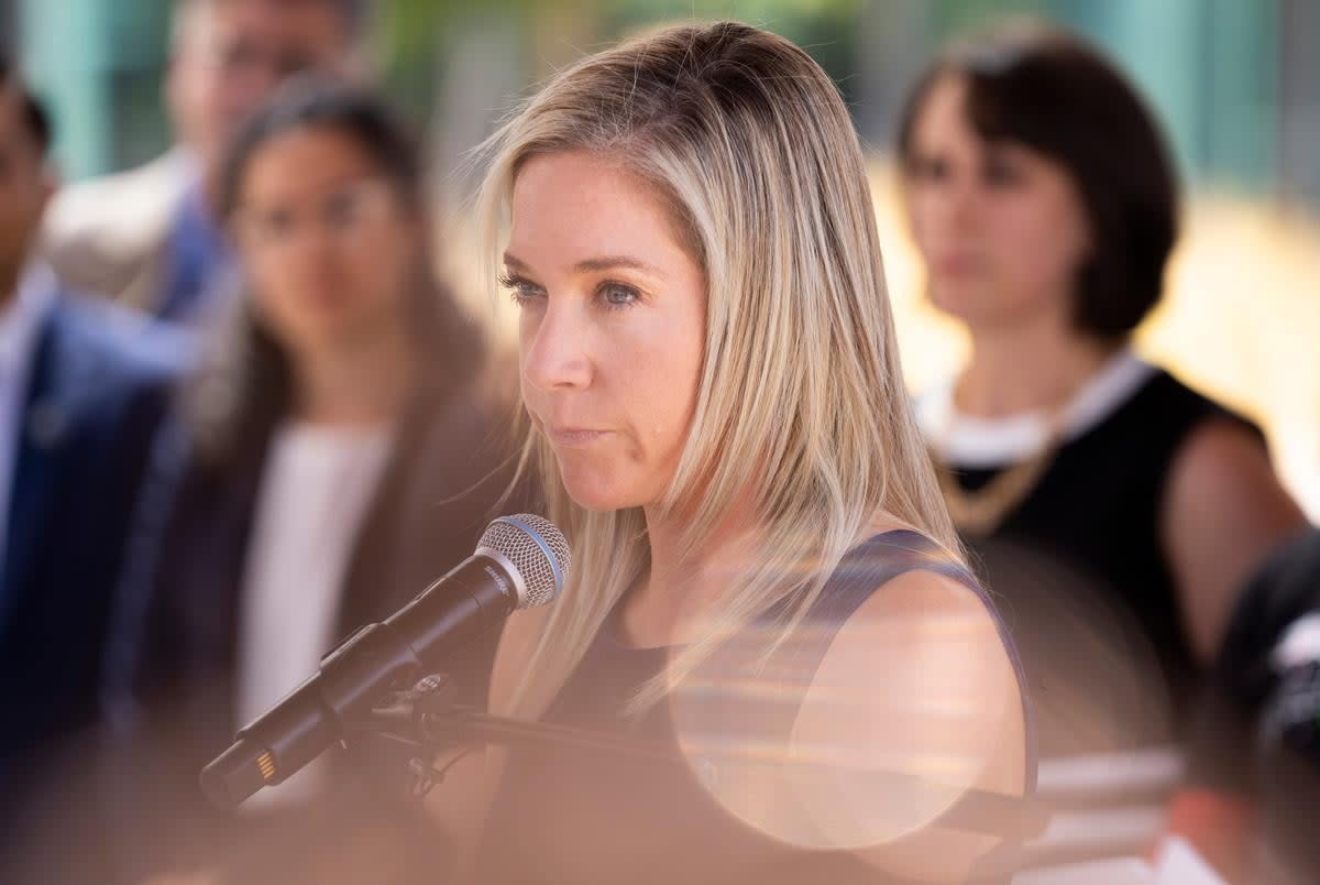 Amanda Zurawski, middle, addresses the press following the first day of testimony for Zurawski v. State of Texas outside the Travis County Civil and Family Courts Facility in Austin on July 19, 2023.