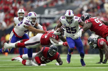 Oct 14, 2018; Houston, TX, USA; Buffalo Bills running back LeSean McCoy (25) runs as Houston Texans linebacker Benardrick McKinney (55) and linebacker Whitney Mercilus (59) defend during the second half at NRG Stadium. Mandatory Credit: Kevin Jairaj-USA TODAY Sports