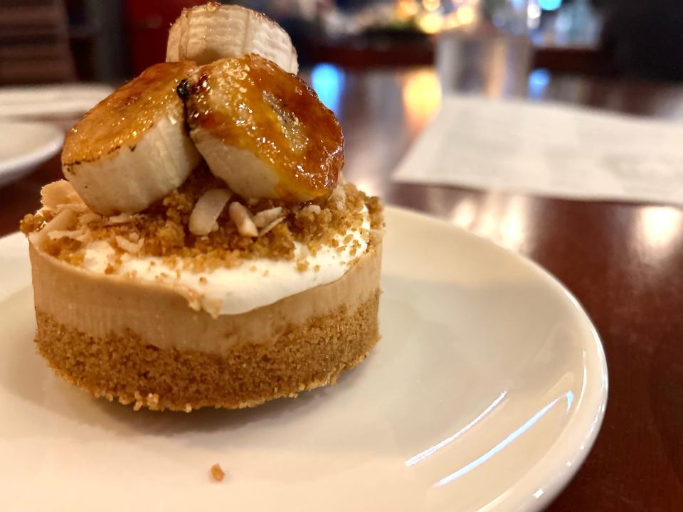 The Diplomat's Peanut Butter Pie is topped with caramelized banana slices that balance the richness of the standout dessert.