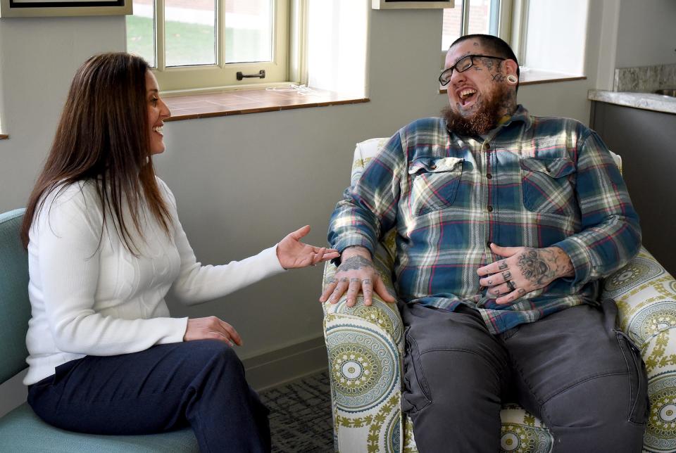 Nicole Kennedy, 43, IHM nursing home administrator, reminisces with Tyler Rupp, 30, about the time as his nurse she treated his severely burned legs resulting from a traumatic motorcycle accident.