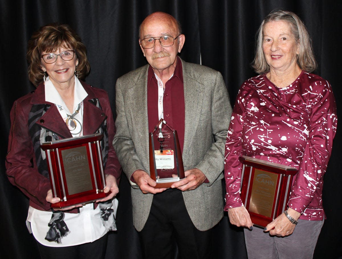 Ada Bair, Roby Williams and Sue Tillotson hold their awards.