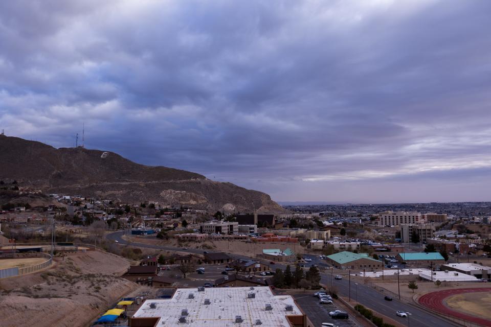 Clouds hover over the Franklin Mountains in Central El Paso on a gloomy morning on Wednesday, Feb. 7, 2024.