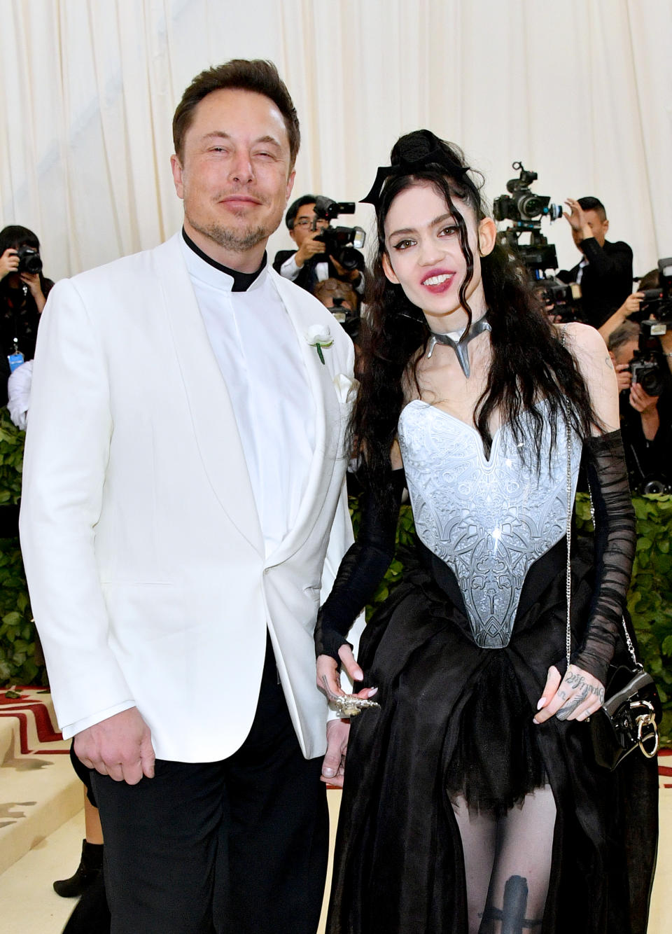 NEW YORK, NY - MAY 07:  Elon Musk and Grimes attend the Heavenly Bodies: Fashion & The Catholic Imagination Costume Institute Gala at The Metropolitan Museum of Art on May 7, 2018 in New York City.  (Photo by Dia Dipasupil/WireImage)