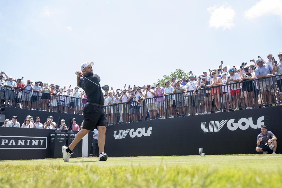 Captain Jon Rahm, of Legion XIII, hits from the first tee during the final round of LIV Golf Nashville at The Grove, Sunday, June 23, 2024, in College Grove, Tenn. (Charles Laberge/LIV Golf via AP)