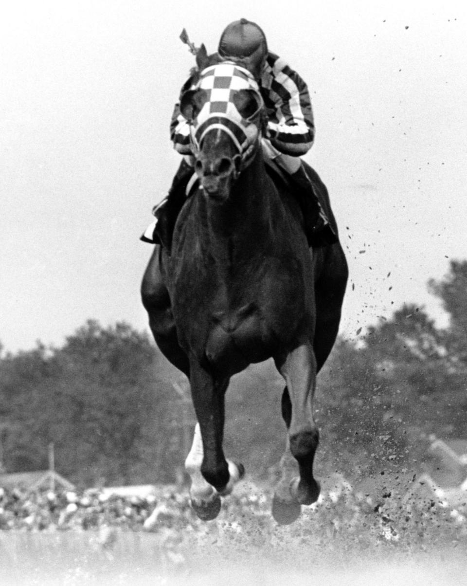 ** FILE ** In this May 5, 1973 file photo, jockey Ron Turcotte rides Secretariat to victory in the 99th Kentucky Derby at Churchill Downs in Louisville, Ky. If Big Brown wins the Belmont Stakes in three weeks and claims racing's first Triple Crown in 30 years, he must be mentioned with racing royalty such as Secretariat and Affirmed.  (AP Photo/File)