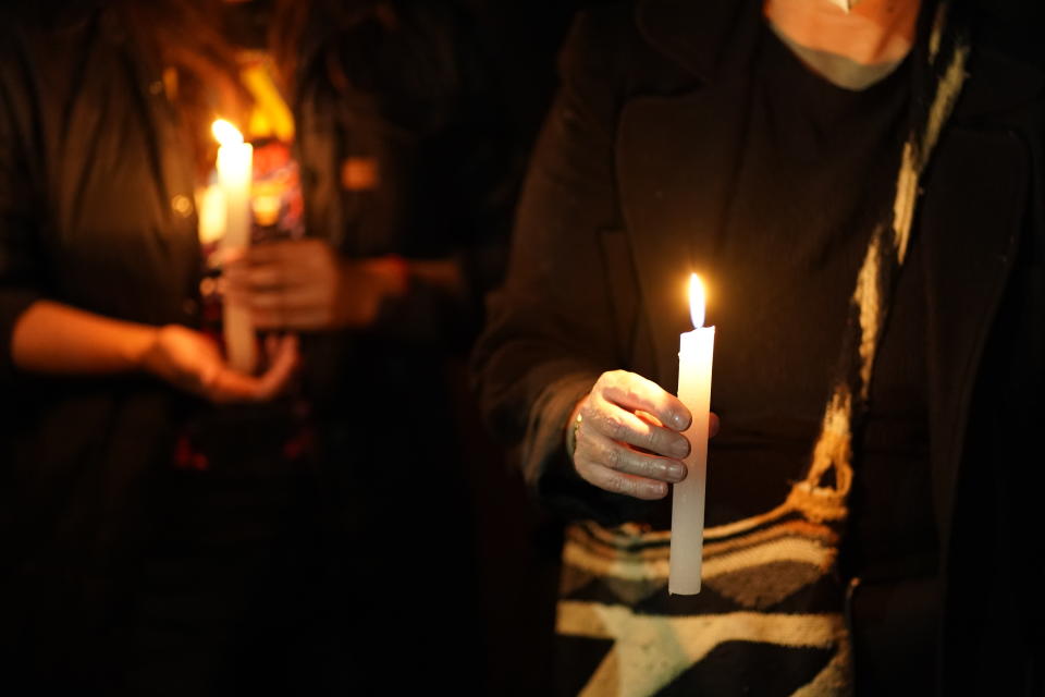 People hold candles during a protest against the murder of journalist Lourdes Maldonado and freelance photojournalist Margarito Martinez, which occurred in Tijuana within the span of a week, in Mexico City, Tuesday, Jan. 25, 2022. Demonstrations were held in more than a dozen cities across Mexico to protest the killings of three journalists in the last two weeks. The third slain journalist is Jose Luis Gamboa. (AP Photo/Eduardo Verdugo)