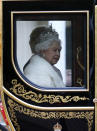 Britain's Queen Elizabeth II travels in a carriage to parliament for the official State Opening of Parliament in London, Monday, Oct. 14, 2019. (AP Photo/Frank Augstein)