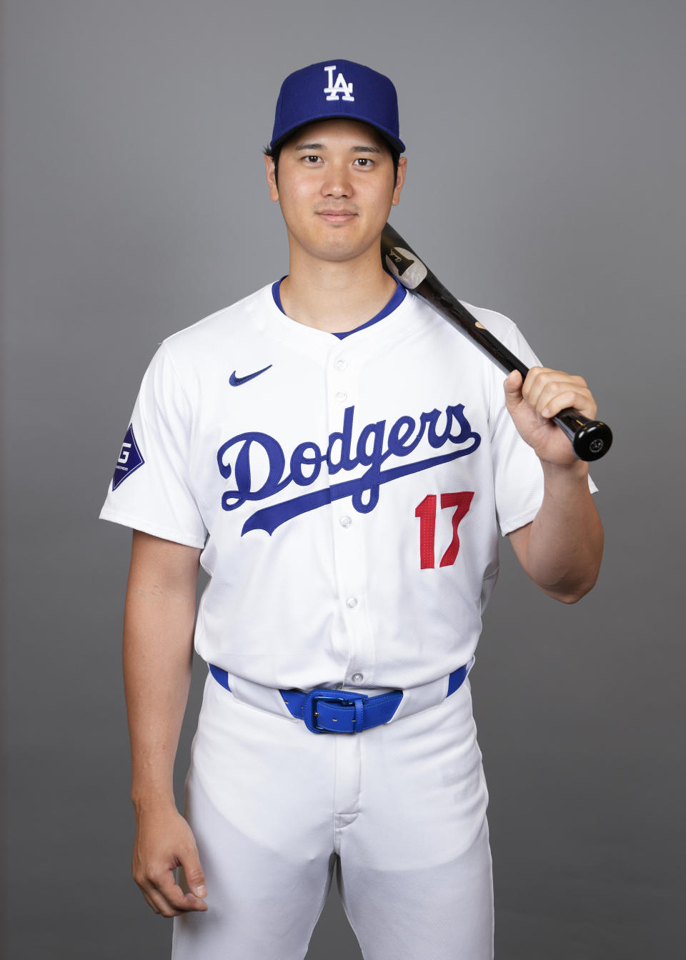 Los Angeles Dodgers designated hitter Shohei Ohtani poses for a photo during a spring training baseball photo day on Wednesday, Feb. 21, 2024, in Phoenix. (AP Photo/Ashley Landis)