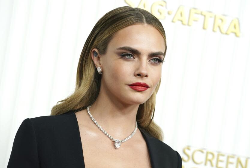 Cara Delevingne, dressed in black with diamong necklace at the 29th annual Screen Actors Guild Awards in LA