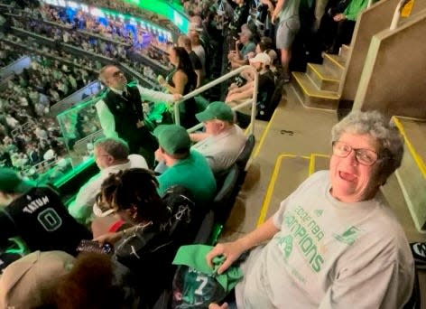 Peggy McGowan of Fall River watches a Boston Celtics game at TD Garden in Boston. McGowan was a social worker and longtime crossing guard for Fall River Public Schools beloved by students.