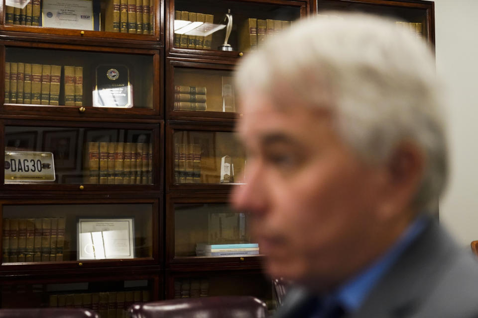 Law books sit in a bookcase as district attorney Steve Mulroy speaks during an interview with the Associated Press, in response to the investigation of the death of Tyre Nichols, who died after being beaten by Memphis police officers, in Memphis, Tenn., Tuesday, Jan. 24, 2023. (AP Photo/Gerald Herbert)