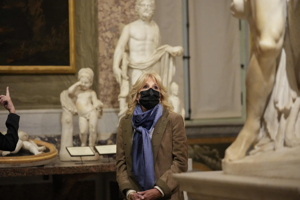 U.S. first lady Jill Biden admires Bernini sculptures during a visit to the Borghese Gallery and Museum on the sidelines of the G20 summit in Rome, Sunday, Oct. 31, 2021. Leaders of the world's biggest economies made a compromise commitment Sunday to reach carbon neutrality "by or around mid-century" as they wrapped up a two-day summit that was laying the groundwork for the U.N. climate conference in Glasgow, Scotland. (AP Photo/Alessandra Tarantino)