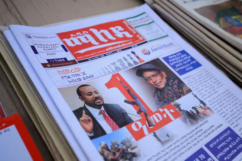 FILE PHOTO: Ethiopia’s Prime Minister Ahmed and leader of the Tigray People's Liberation Front (TPLF) party Gebremichael are pictured on the Maleda Local News papers, in Addis Ababa