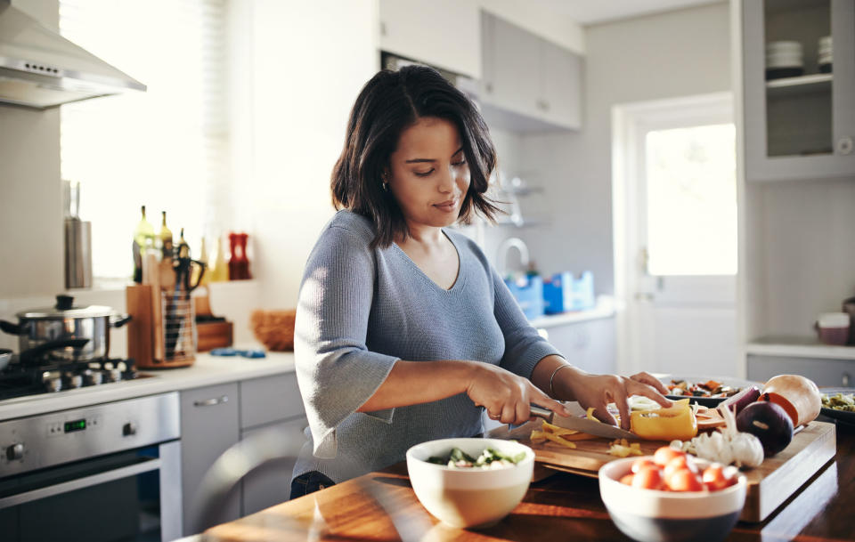 person cutting vegetables