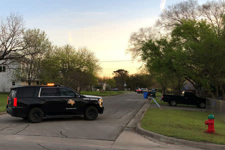 A Texas Department of Public Safety vehicle blocks a street into the neighborhood where the Austin bomb suspect may lived in Pfluggerville, Texas, U.S., March 21, 2018. REUTERS/Jon Herskovitz