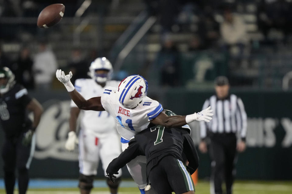 Tulane defensive back Lance Robinson (7) breaks up a pass intended for Southern Methodist wide receiver Rashee Rice (11) during the first half of an NCAA college football game in New Orleans, Thursday, Nov. 17, 2022. (AP Photo/Gerald Herbert)