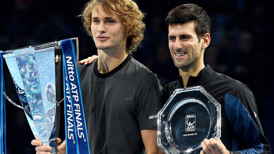 Alexander Zverev and Novak Djokovic posing with their trophies. (Photo by Hannah Fountain – CameraSport via Getty Images)