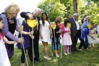 Commissioner Marie Wilson (L), Canada's Governor General David Johnston, Sharon Johnston, Justice Murray Sinclair, and Commissioner Chief Wilton Littlechild place heart shaped cards in the Heart Garden with school children during the Truth and Reconciliation Commission of Canada closing ceremony at Rideau Hall in Ottawa June 3, 2015. REUTERS/Blair Gable