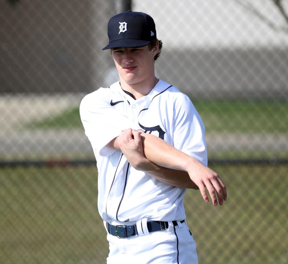 Tigers pitching prospect Jackson Jobe stretches during practice at the spring training minor league minicamp Thursday, Feb.17, 2022 at Tiger Town in Lakeland, Florida.