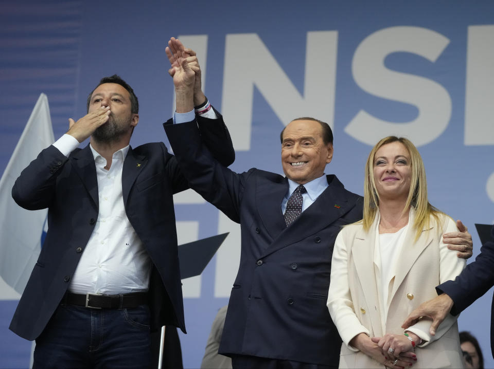 FILE - From left: The League's Matteo Salvini, Forza Italia's Silvio Berlusconi, and Brothers of Italy's Giorgia Meloni attend the center-right coalition closing rally in Rome on Sep. 22, 2022. Berlusconi, the boastful billionaire media mogul who was Italy's longest-serving premier despite scandals over his sex-fueled parties and allegations of corruption, died, according to Italian media. He was 86. (AP Photo/Gregorio Borgia, File)