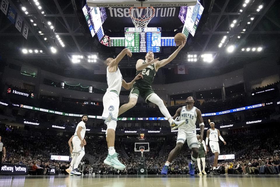 Milwaukee Bucks' Pat Connaughton shoots during the second half of an NBA basketball game against the Minnesota Timberwolves Thursday, Feb. 8, 2024, in Milwaukee. (AP Photo/Morry Gash)