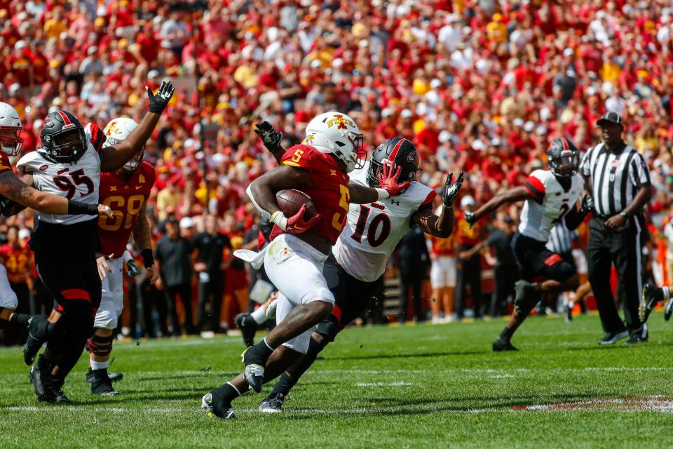 Iowa State running back Cartevious Norton stiff arms Southeast Missouri State defensive back Dony’e Taylor during the Iowa State-Southeast Missouri State game.