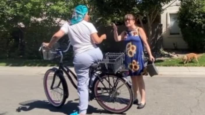 Ronnie Marie Paiva (left), delivering items to a customer on her bicycle, was confronted recently by an unnamed woman (right) who said it looked like she was dealing drugs. (TikTok)