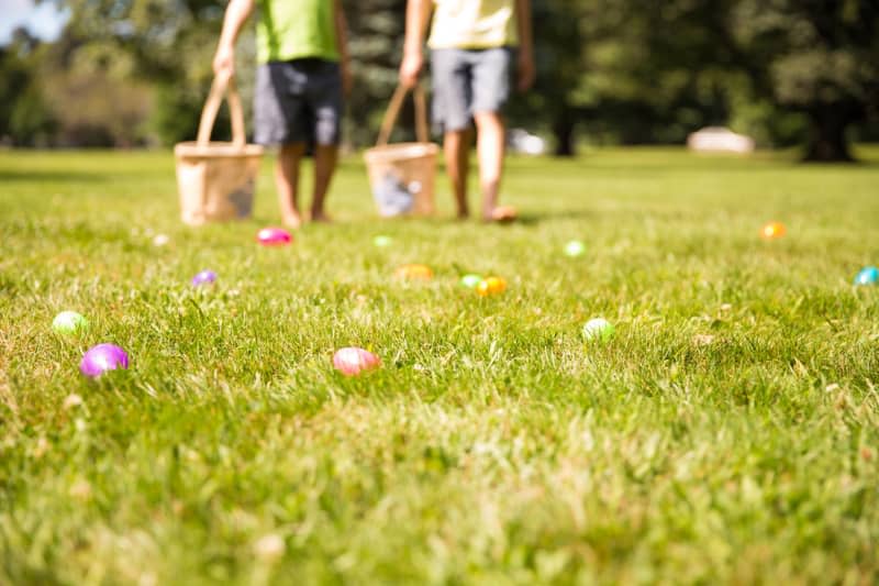 Blurred silhouettes of children with baskets in hands. the concept of family fun at Easter. blurred background.