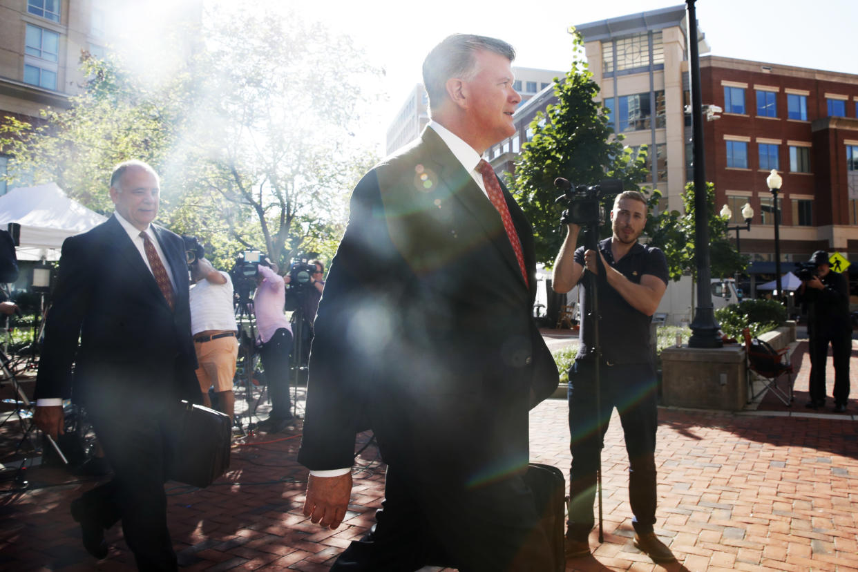 Attorney Thomas Zehnle, left, and Kevin Downing, walk with the defense team for Paul Manafort to federal court as the trial of the former Trump campaign chairman continues, in Alexandria, Va., Tuesday, Aug. 14, 2018. (AP Photo/Jacquelyn Martin)