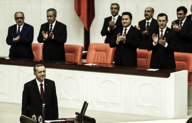 Turkey's new president Recep Tayyip Erdogan (front) attends the presidential swearing in ceremony at the parliament in Ankara on August 28, 2014