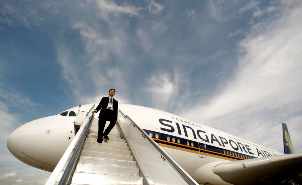 A Singapore Airlines staff member walks down a set of stairs from an Airbus A380 in Sydney. (REUTERS/Tim Wimborne/File Photo)