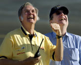 FILE- In this June 21, 2004, file photo project designer Burt Rutan, left, and sponsor Paul Allen watch the approach and landing of SpaceShipOne after a trip to suborbital space at Mojave, Calif. Prior to his death on Monday, Oct. 15, 2018, Allen invested large sums in technology ventures, research projects and philanthropies, some of them eclectic and highly speculative. Outside of bland assurances from his investment company, no one seems quite sure what happens now. (AP Photo/Reed Saxon, File)