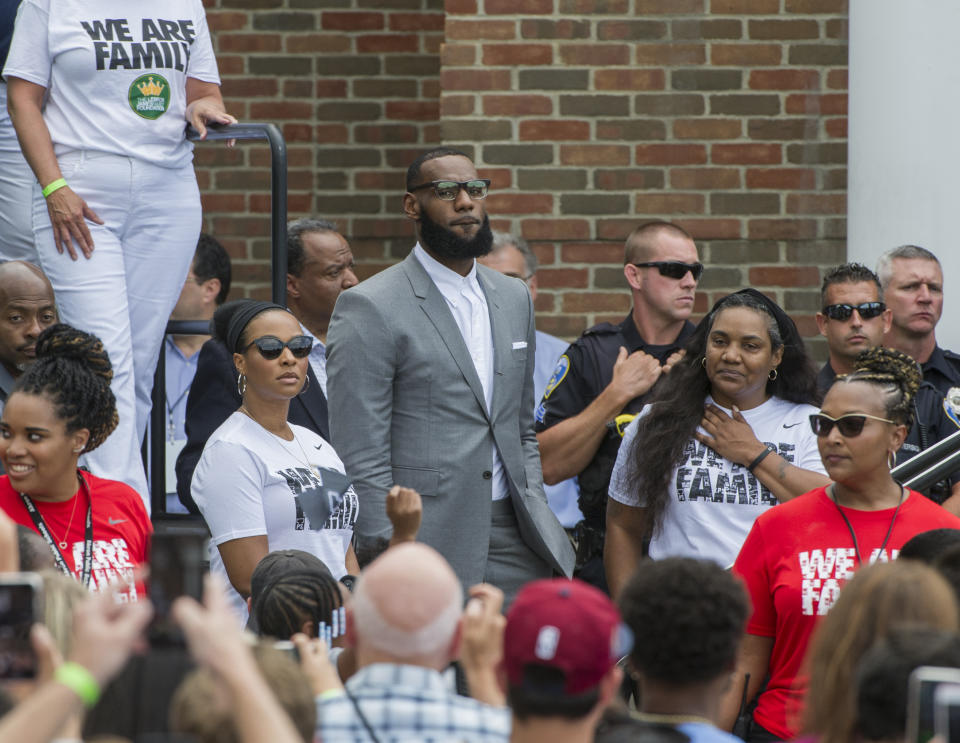 LeBron James surrounded by I PROMISE students and friends in 2018. 