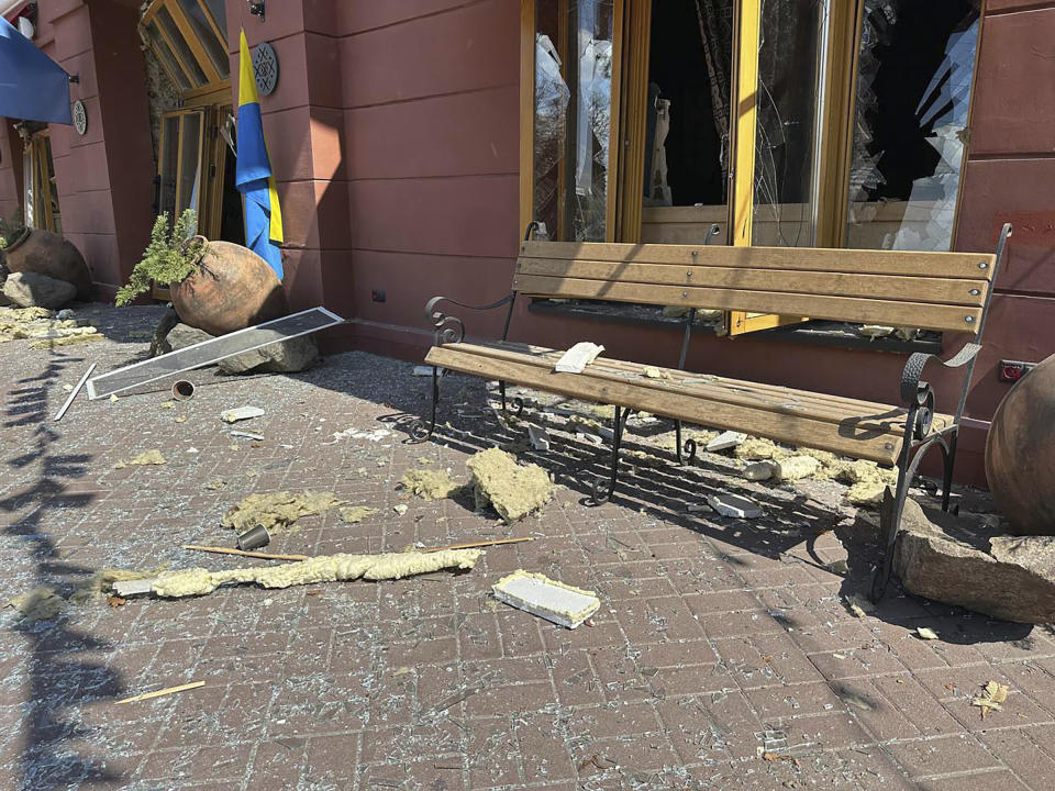 In this photo provided by the Ukrainian Emergency Service, damages are seen in a street after Russian attack in Chernihiv, Ukraine, Saturday, Aug. 19, 2023. (Ukrainian Emergency Service via AP)