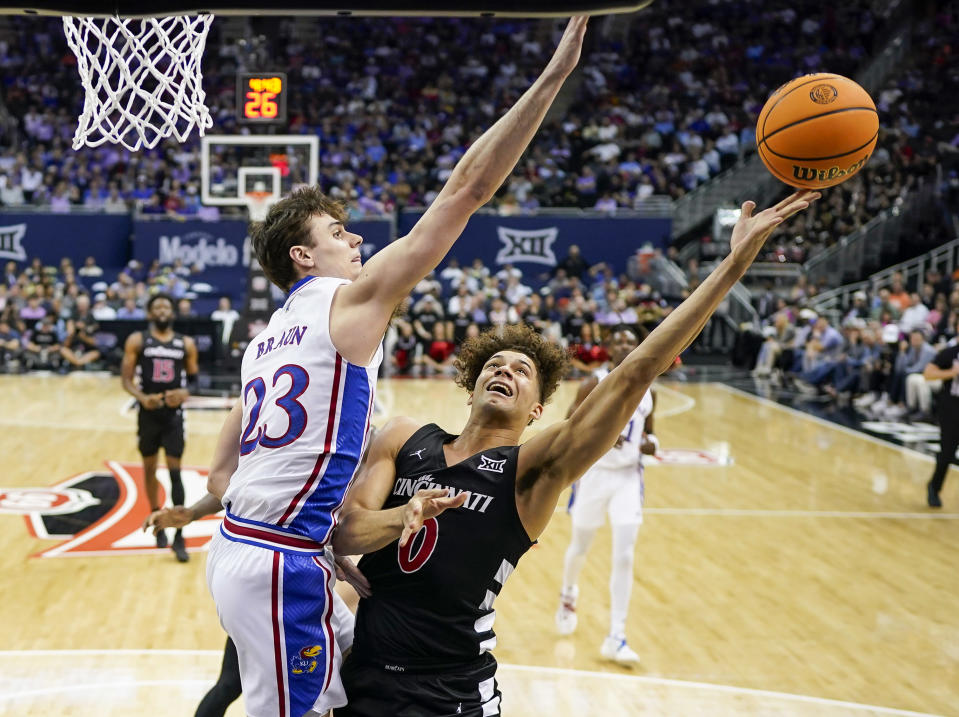 Dan Skillings and Cincinnati knocked off Kansas to reach the quarterfinals of the Big 12 tournament on Wednesday night.