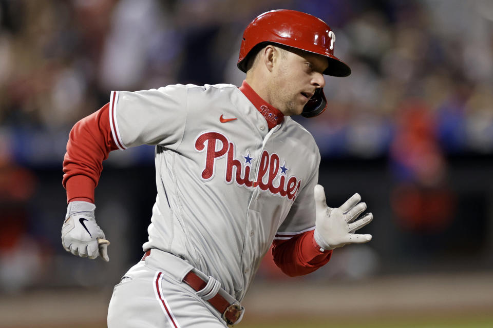 Philadelphia Phillies' Rhys Hoskins rounds first base after hitting a home run during the eighth inning of a baseball game against the New York Mets on Saturday, April 30, 2022, in New York. (AP Photo/Adam Hunger)