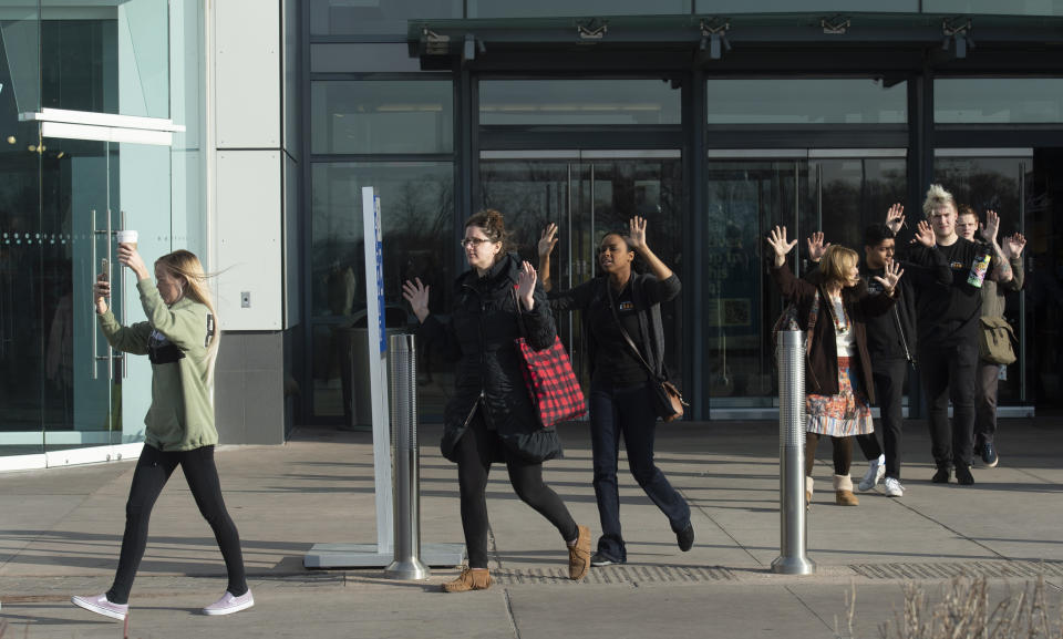 Shoppers are evacuated from Fashion Place Mall in Murray, Utah, after a shooting on Sunday, Jan. 13, 2019. (Rick Egan/The Salt Lake Tribune via AP)